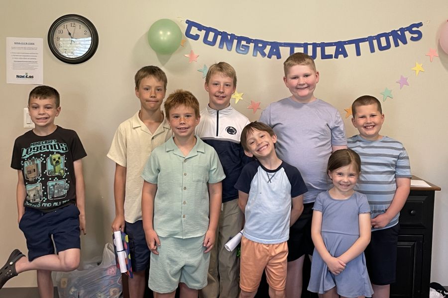 Smiling kids from children's church celebrating the end of the year