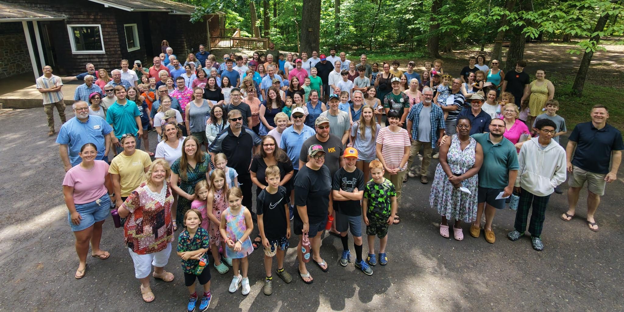 The IVFF church family gathered outdoors for a group photo at Menolan Sunday 2026